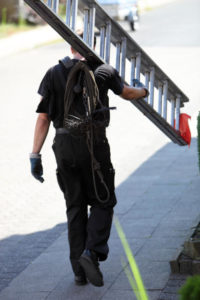 chimney sweep carrying a ladder